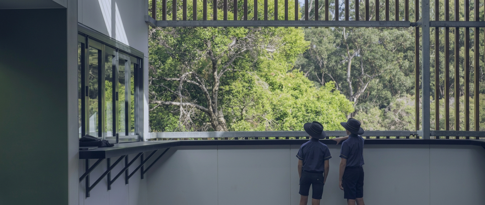 Immanuel students looking out over the rainforest campus