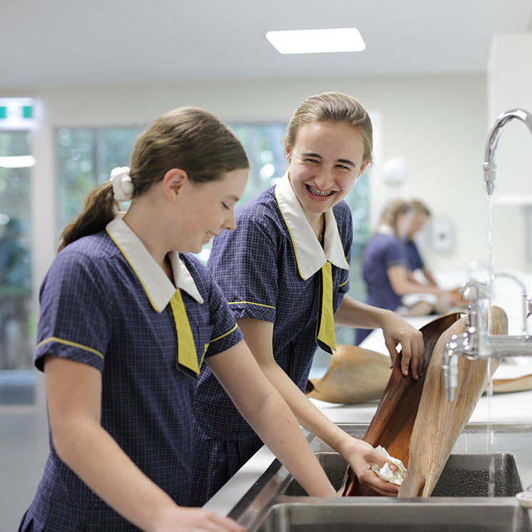 Two year ten girls washing flora in a lab at ILC Independent Private School Sunshine Coast